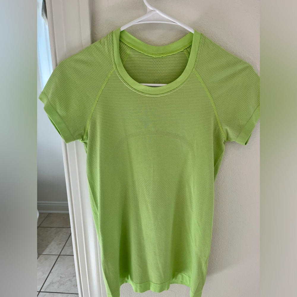 Lululemon swiftly t shirt, size 4, hip length, light green, gently worn